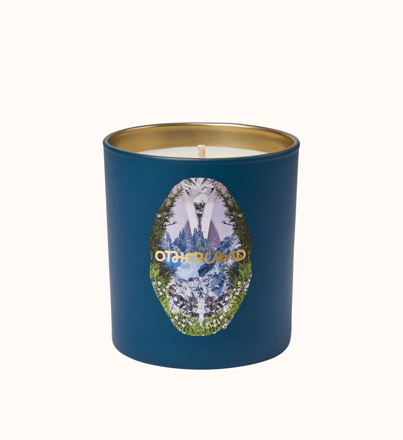 Blue candle with gold lid and 'Otherland' logo on a white background