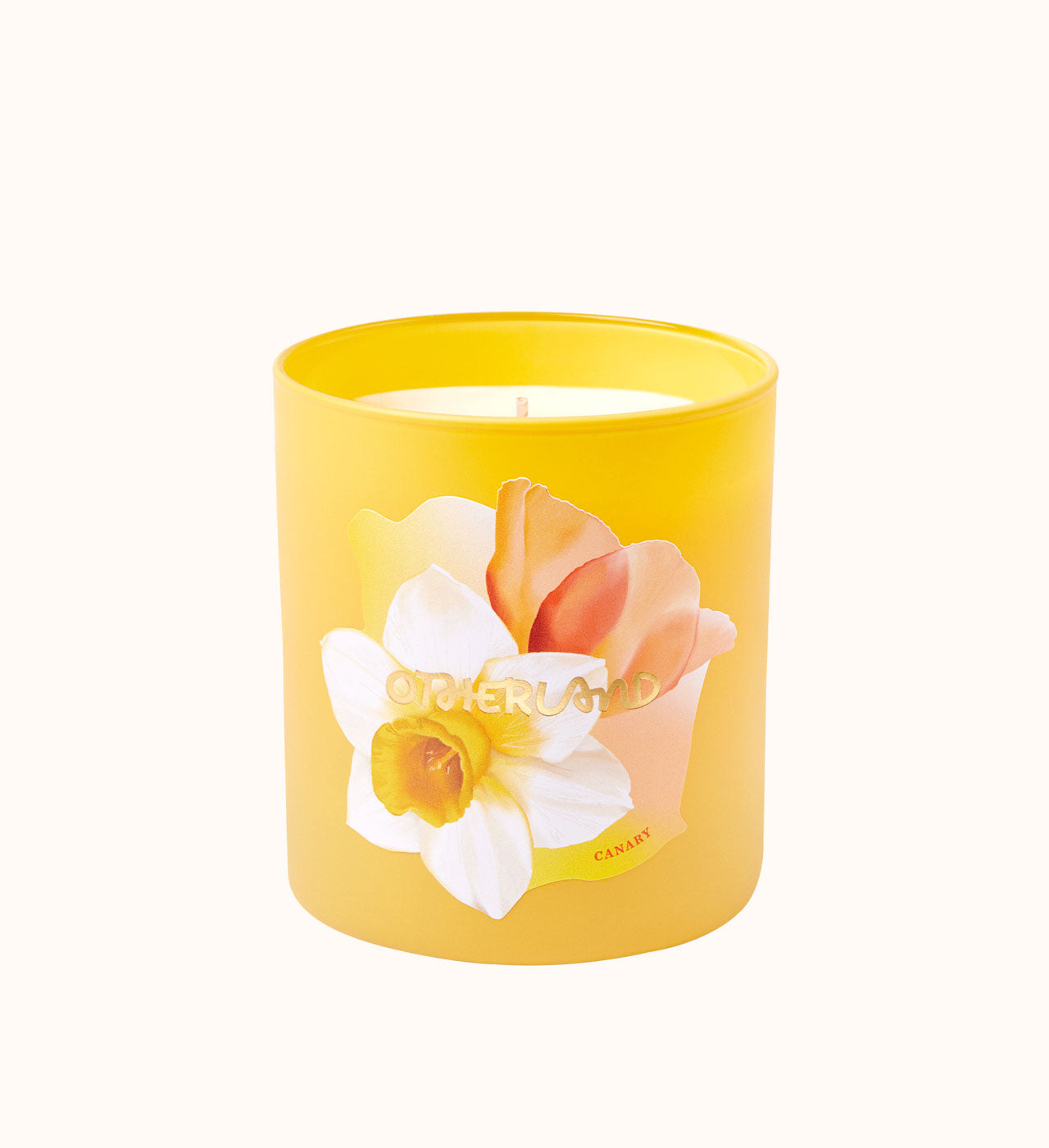 Yellow candle with floral design on a white background