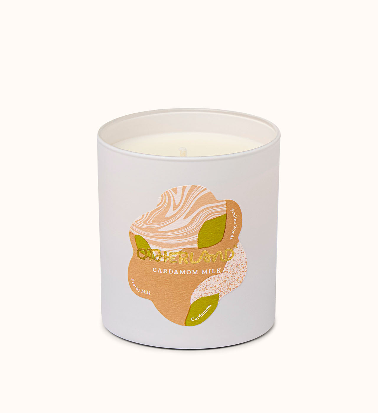 Cardamom milk candle in a white container with a label on a white background