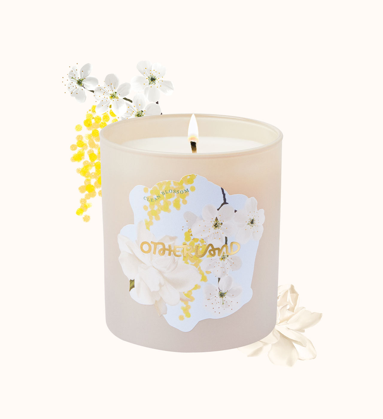 Candle with floral design and 'Otherworld' branding on a white background