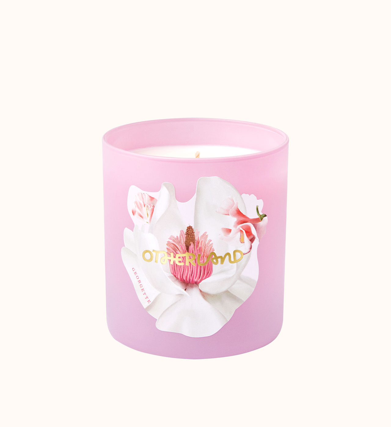 Pink candle with floral design and 'Otherland' branding on a white background