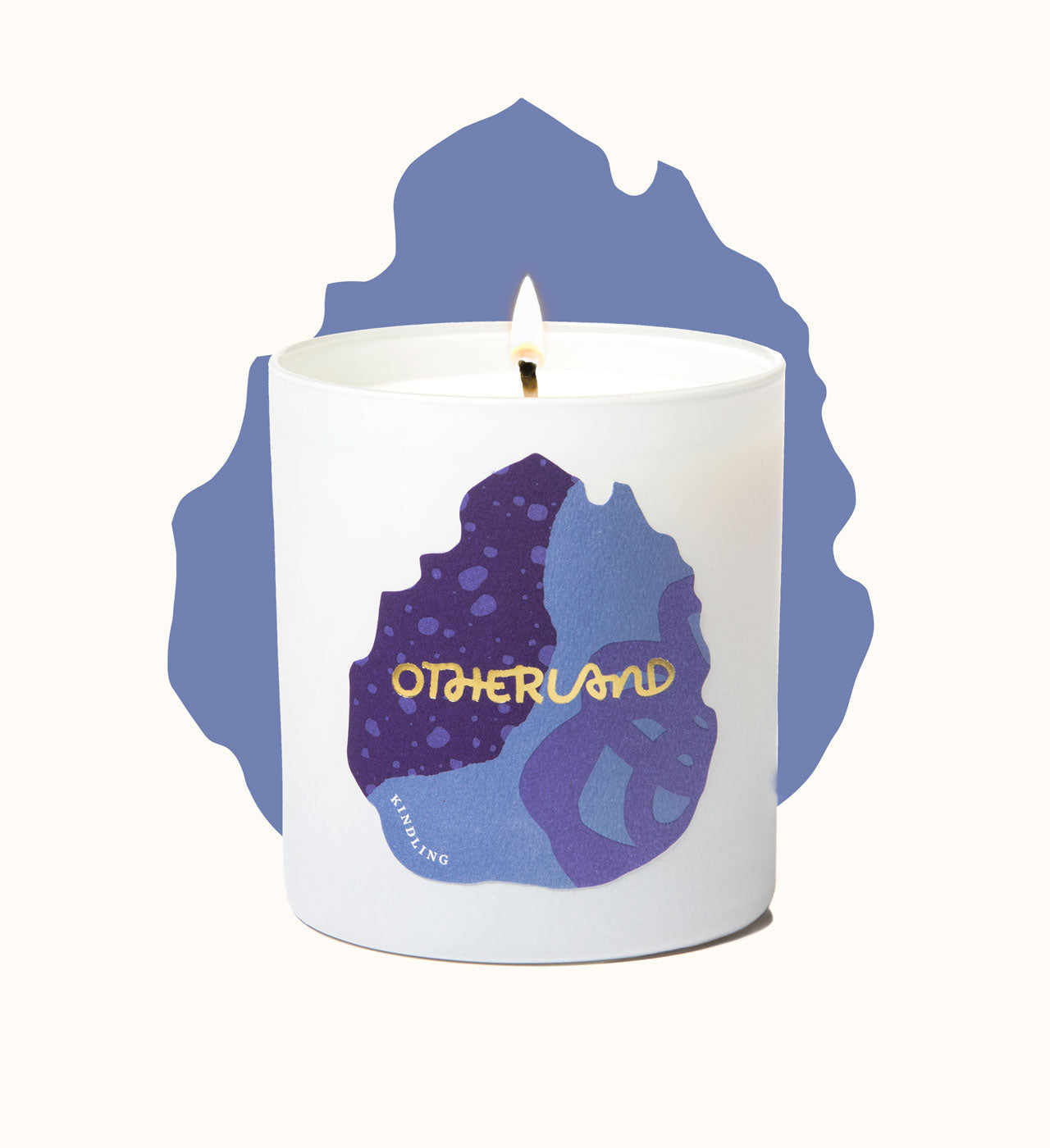 Candle with 'Otherland' branding on a white background