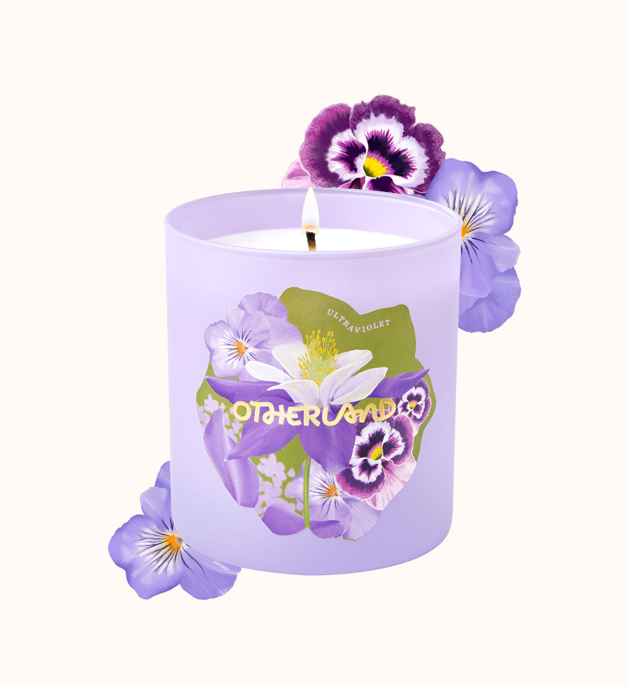 Purple candle with floral design and 'Otherland' branding on a white background