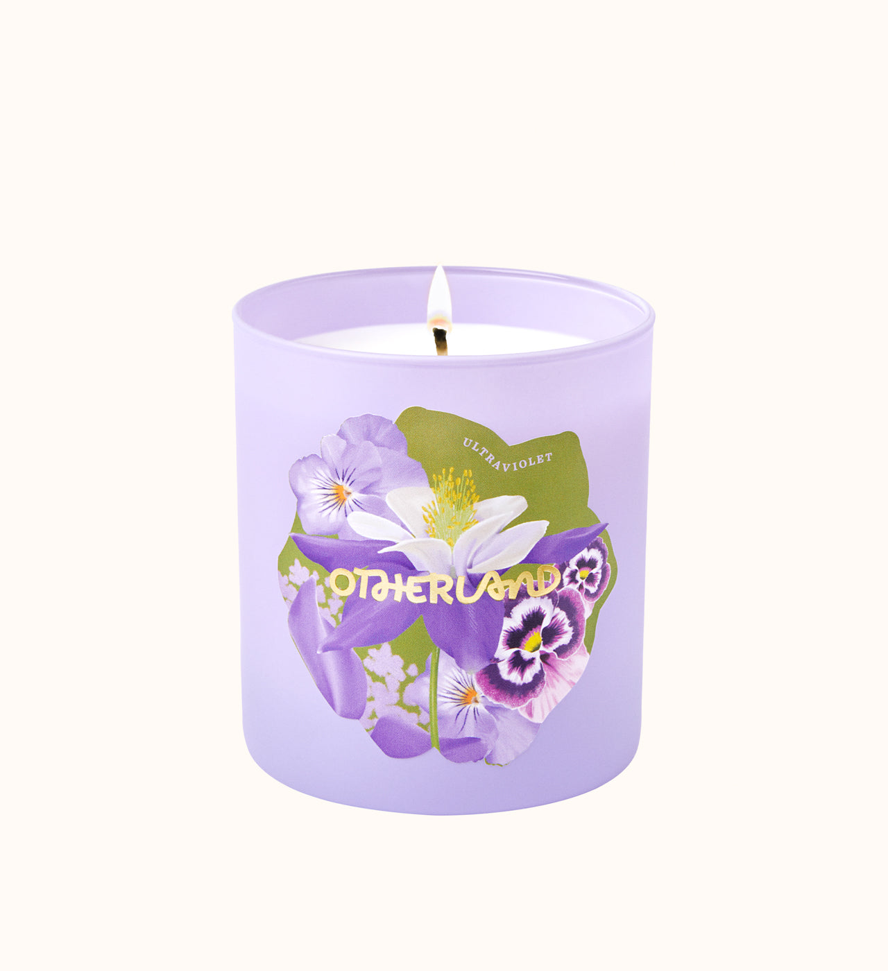 Purple candle with floral design and 'Otherland' branding on a white background