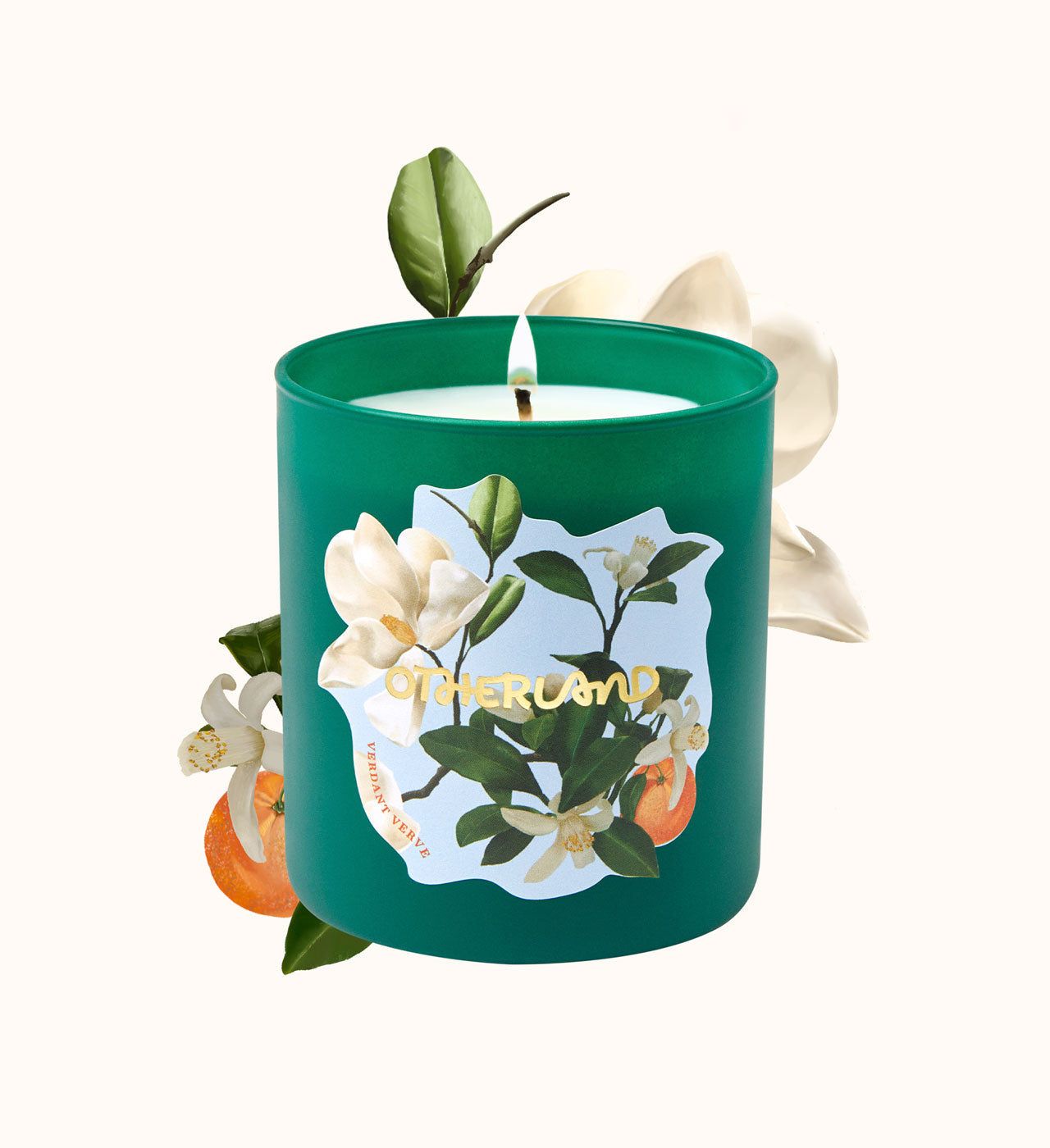 Green candle with floral design and 'Otherland' branding on a white background