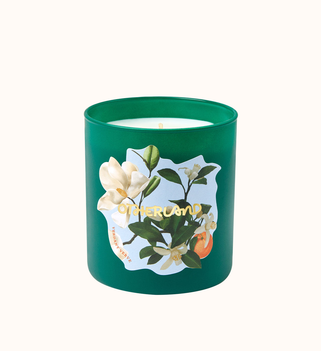 Green candle with floral design and 'Otherland' text on a white background