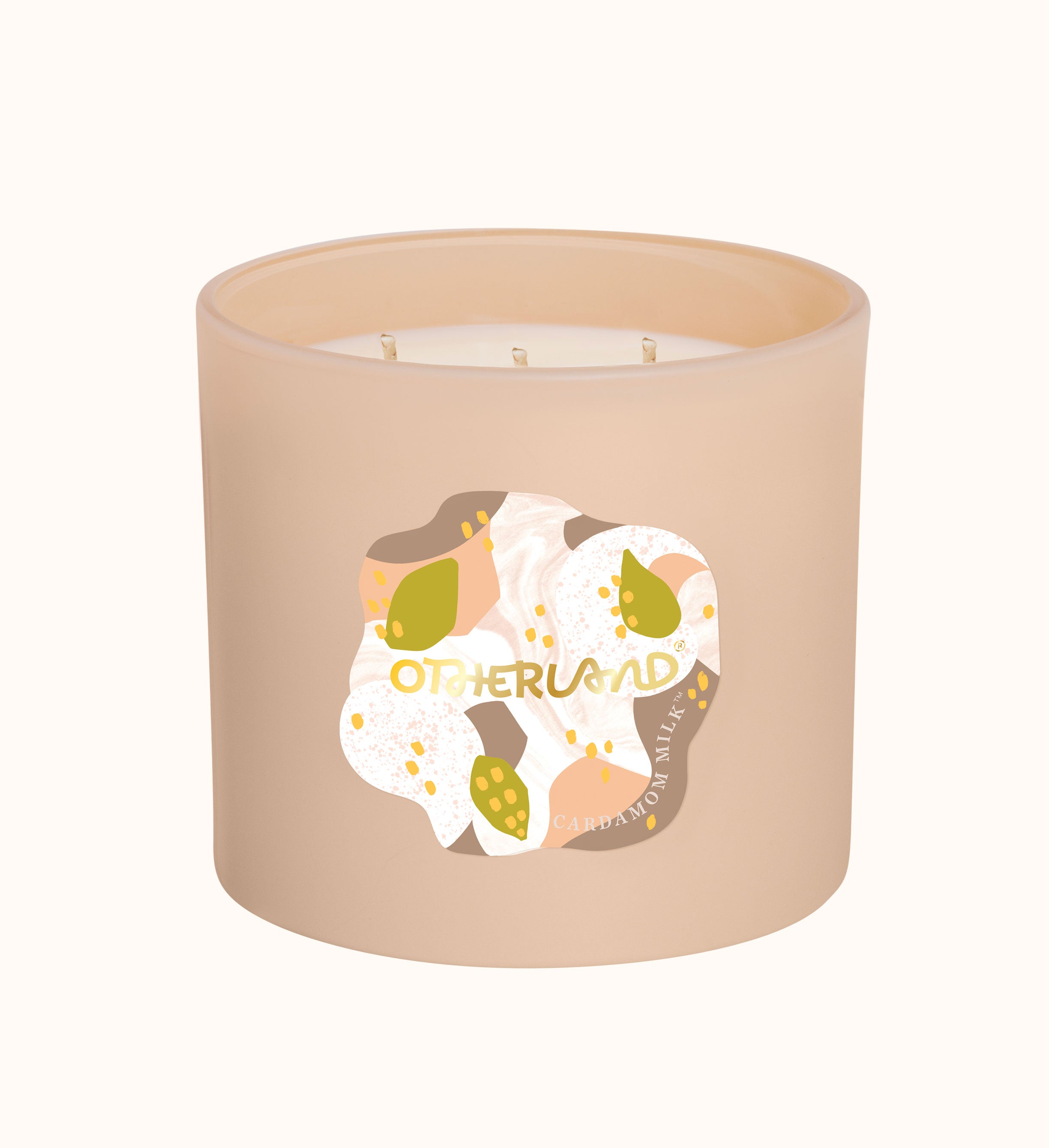 Beige candle with a decorative label on a white background